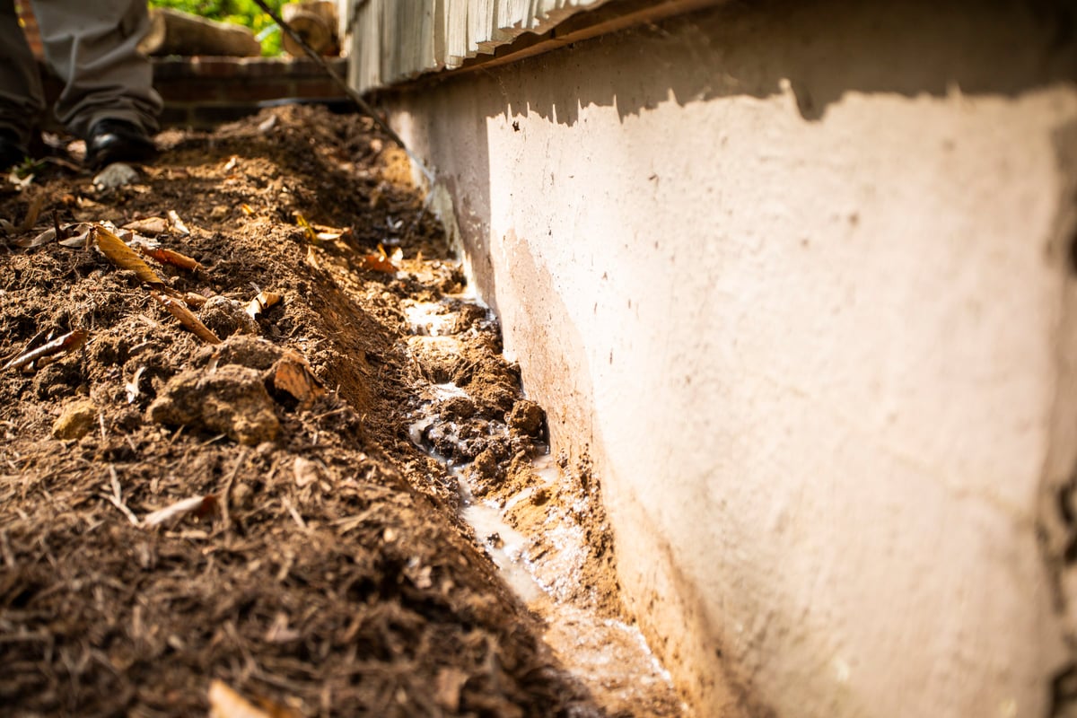 foundation of home with termite trenching
