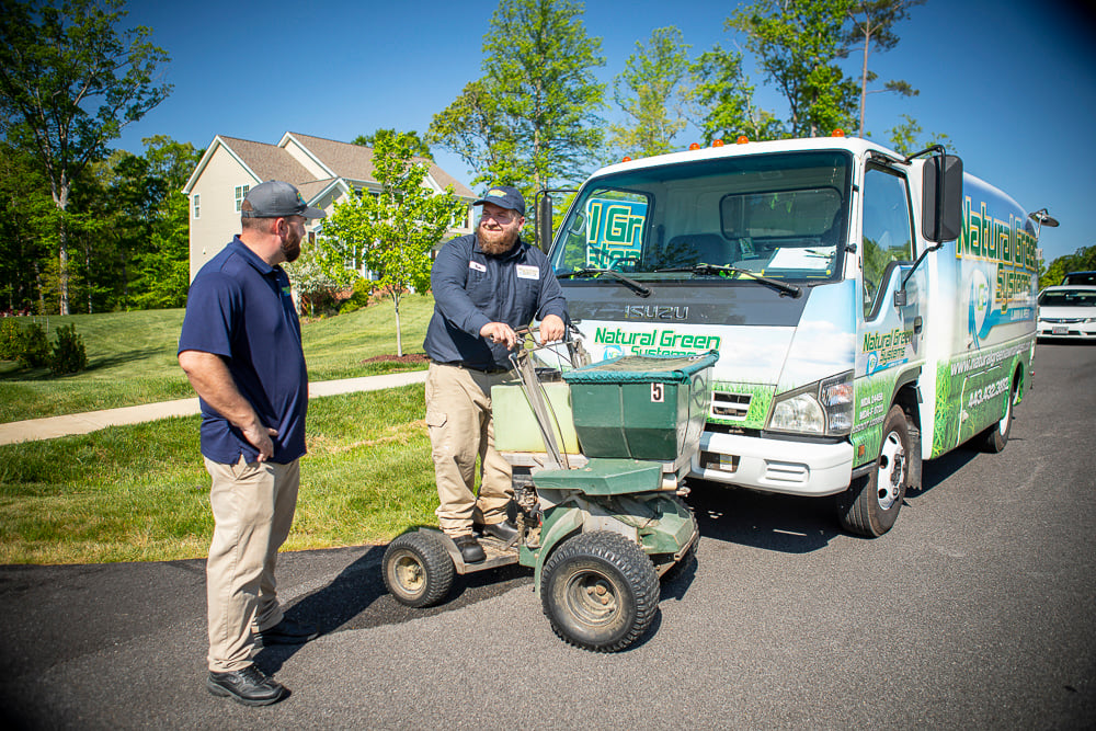 Natural Green lawn care and pest control technicians