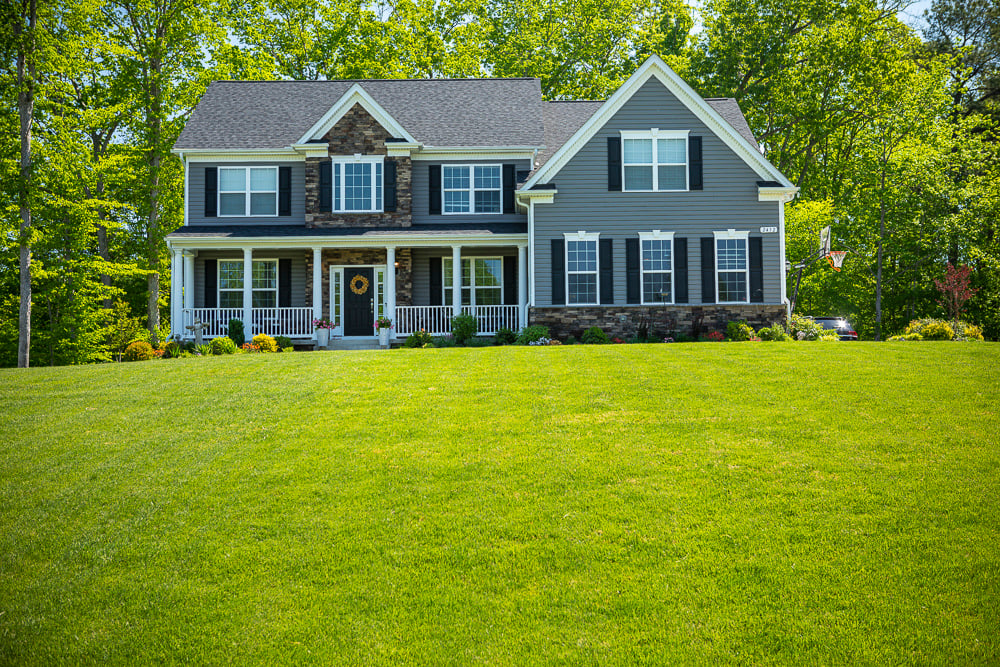home with green and well maintained front lawn