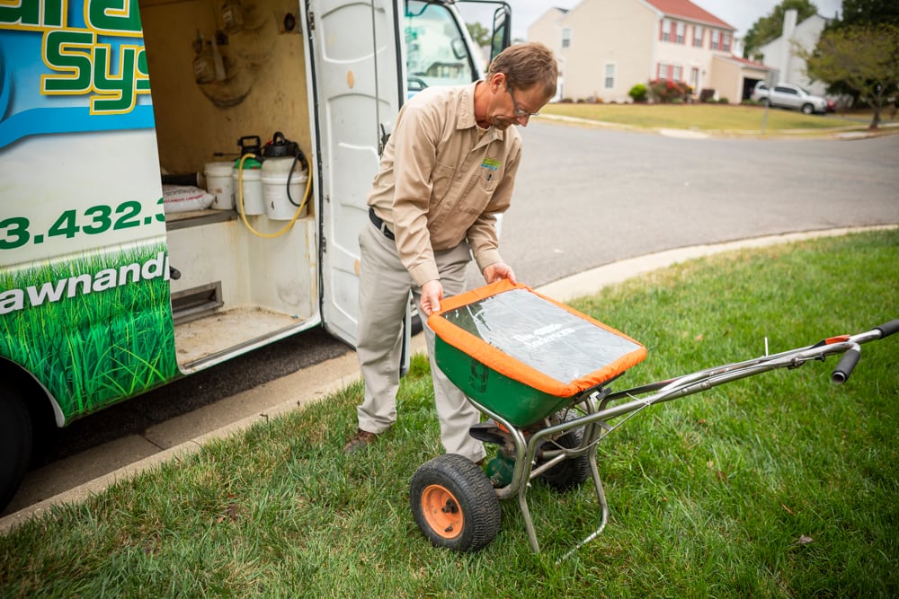 Natural Green Systems Lawn & Pest technician and truck