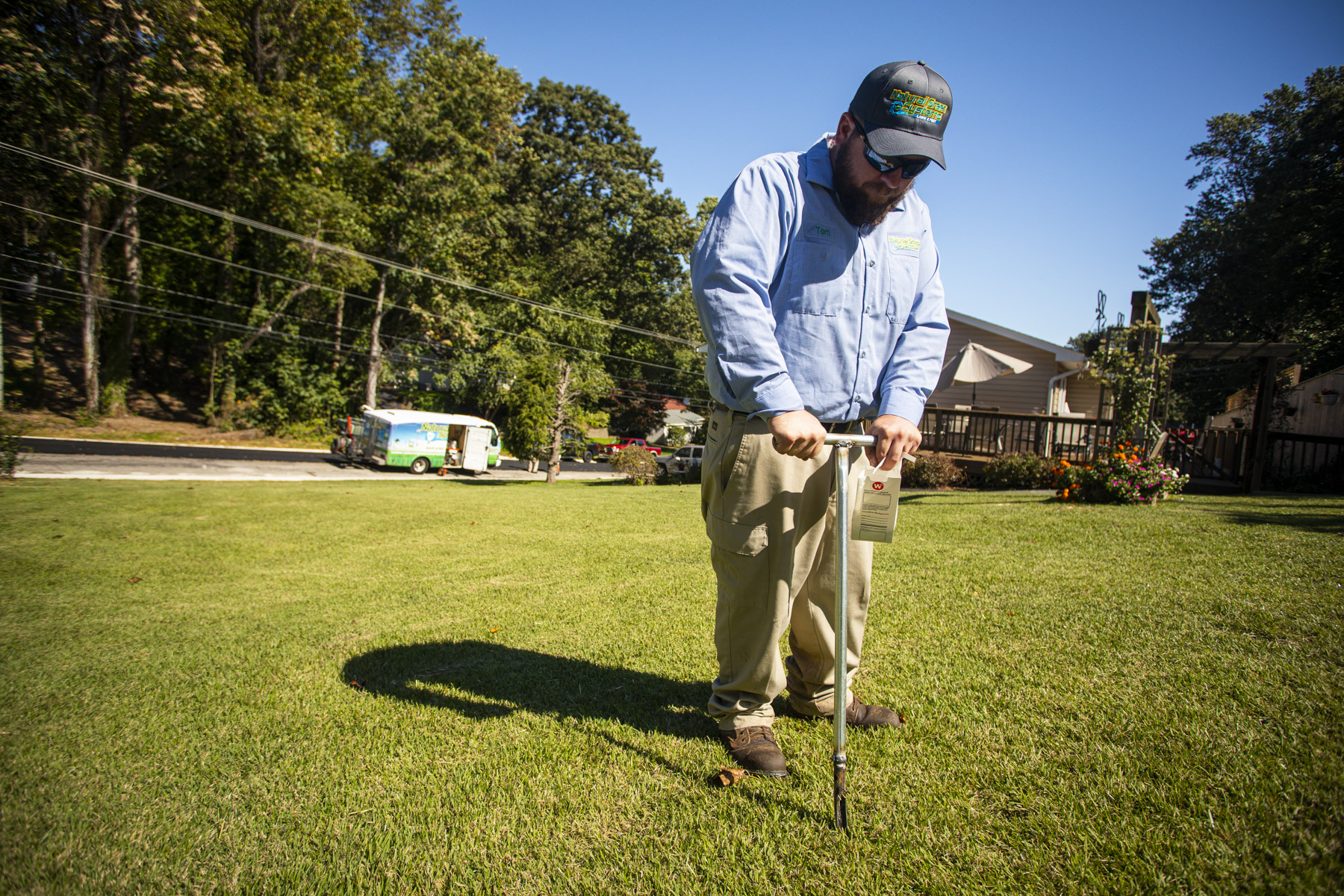 lawn care expert performs soil test